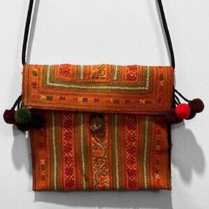 Canvas bohemian crossbody bag with decorative Pompoms​​